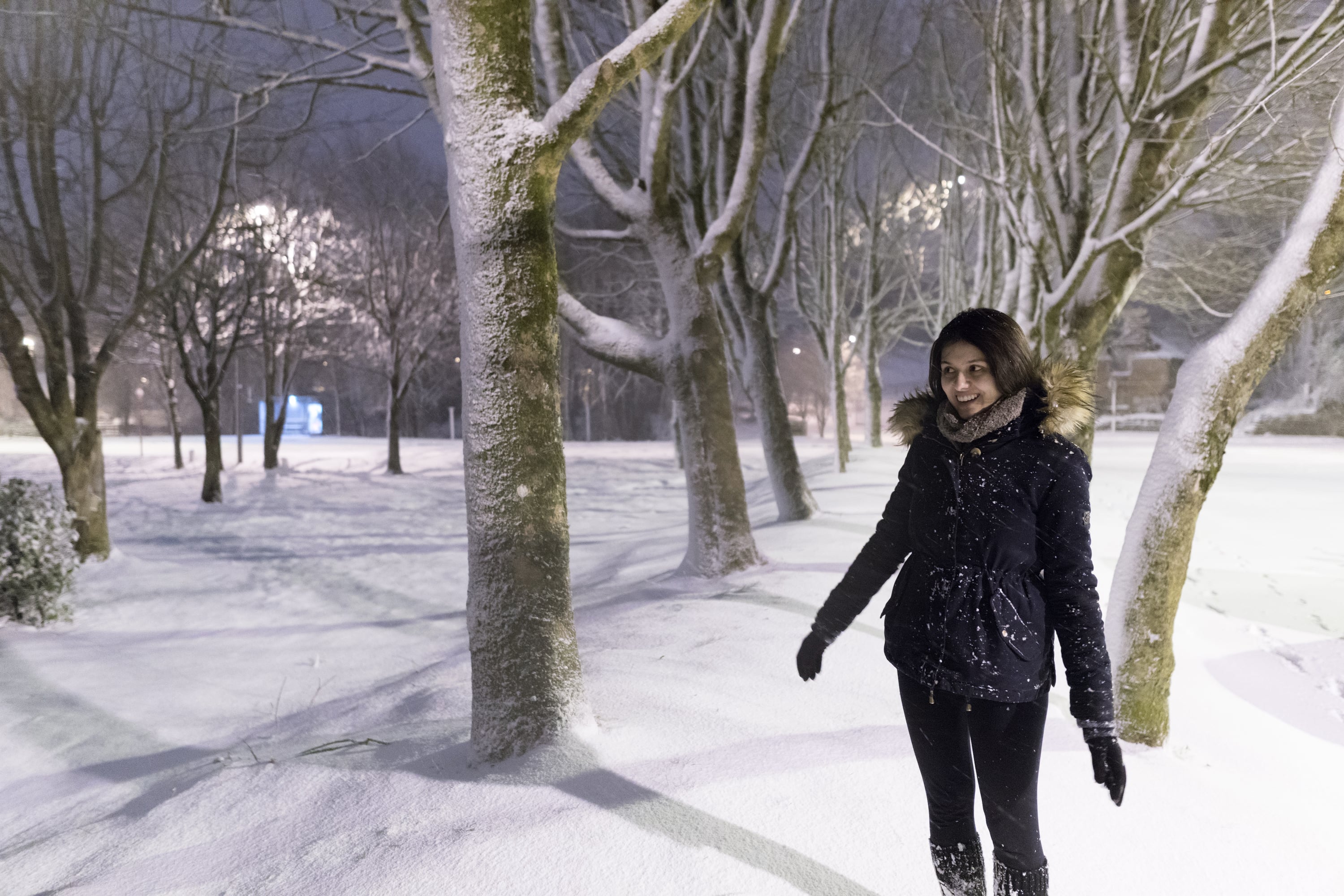 Laura next to trees covered in snow